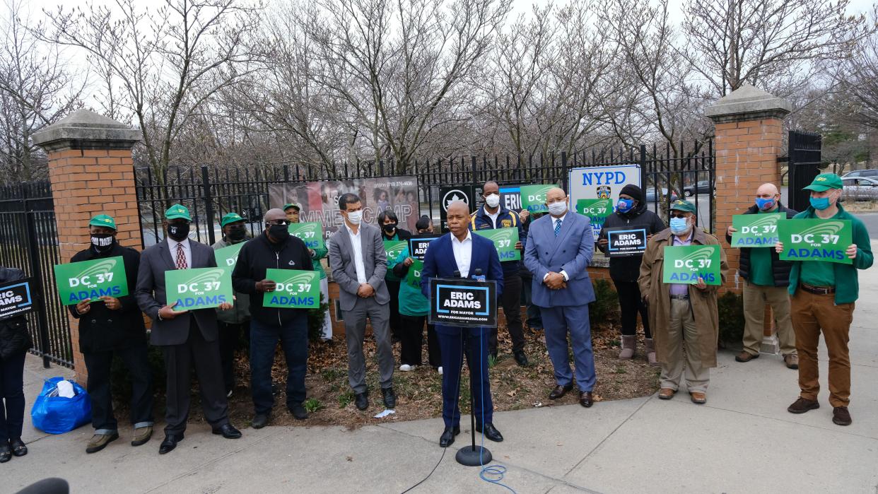 Brooklyn Borough President and New York City mayoral candidate, Eric Adams (c) New York City Council Member Ydanis Rodriguez (left) and Henry Garrido Executive Director of DC 37 (right) 