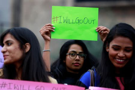 Women wait for the start of the #IWillGoOut rally, organized to show solidarity with the Women's March in Washington, along a street in New Delhi, India January 21, 2017. REUTERS/Cathal McNaughton