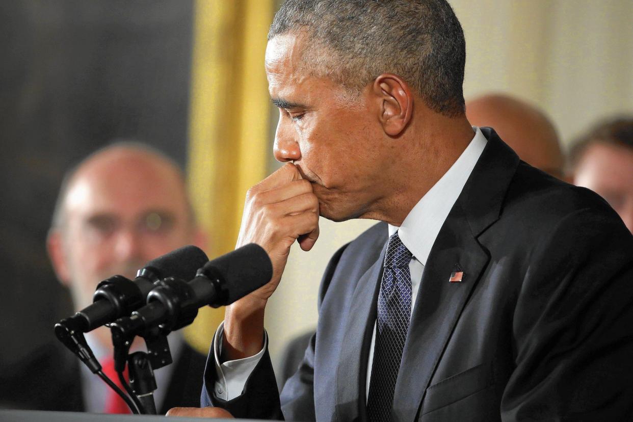 Then-President Barack Obama pauses as he talks about the victims of the 2012 Sandy Hook Elementary School shooting and about his efforts to increase federal gun control in the White House on Jan, 5, 2016.