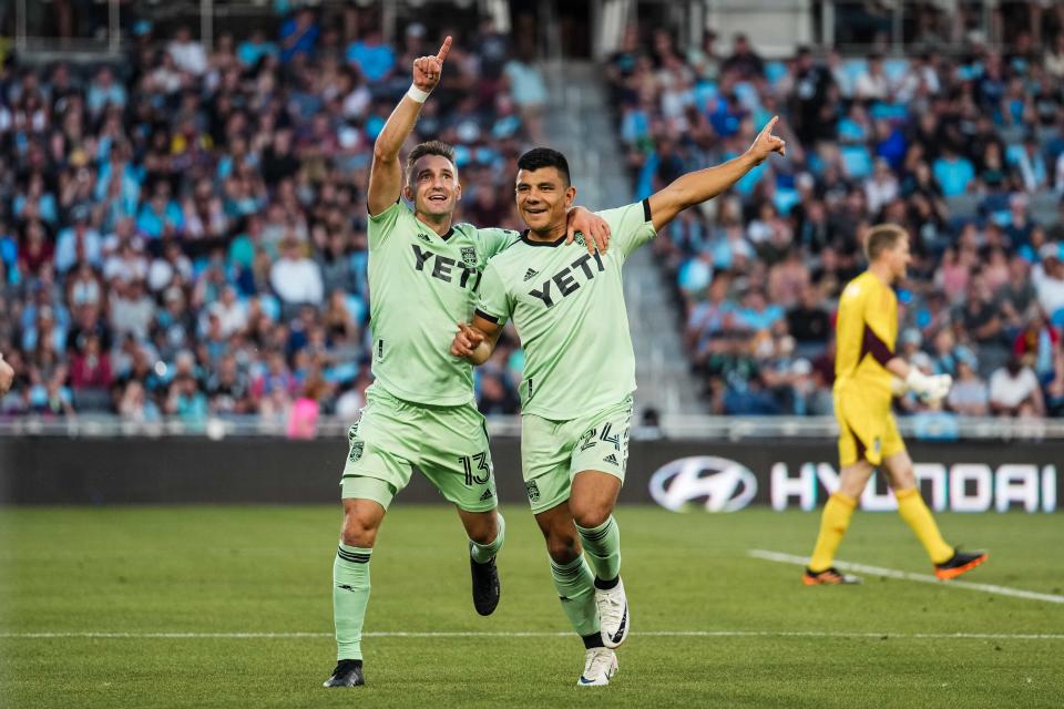 Austin FC midfielder Ethan Finlay, left, celebrates with defender Nick Lima during the second half of Saturday night's 4-1 win over Minnesota United FC at Allianz Field in Saint Paul, Minn. El Tree moved up to fifth place in the Western Conference standings with the win.