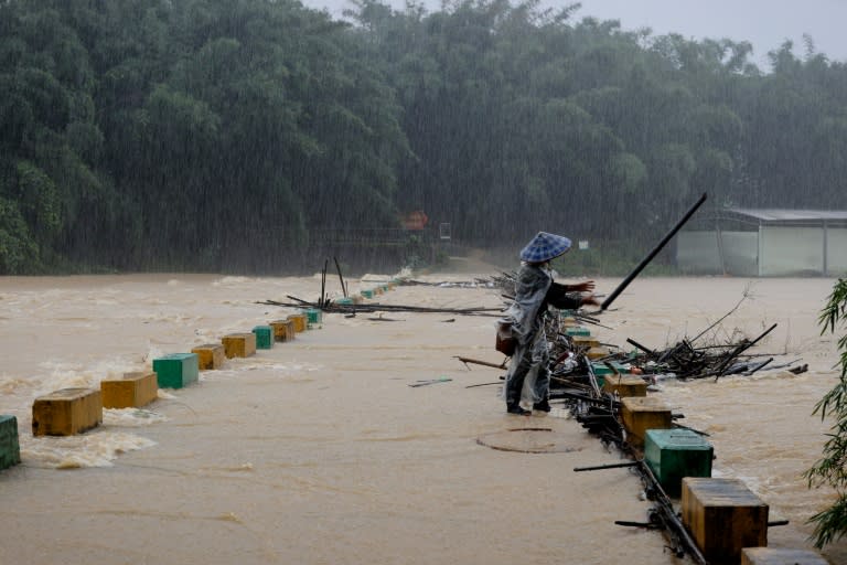 Over a dozen people were missing in China on Tuesday after heavy rains and flooding struck swathes of the south (STR)