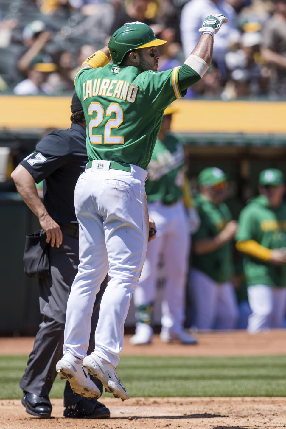 Oakland Athletics' Ramon Laureano reacts after scoring against the Cincinnati Reds during the second inning of a baseball game in Oakland, Calif., Saturday, April 29, 2023. (AP Photo/John Hefti)