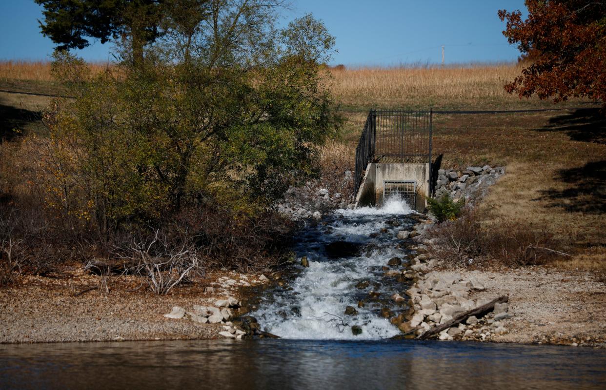 Water from Stockton Lake discharges from a pipeline into Fellows Lake on Tuesday, Nov. 1, 2022. Low water levels at Fellows Lake necessitated the pumping of water.