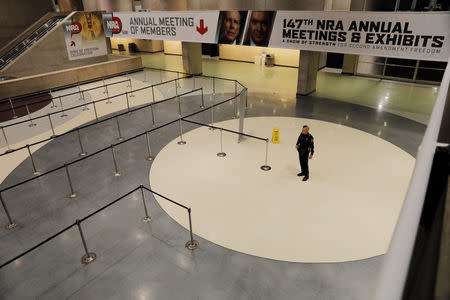 A police officer stands outside of the convention hall where the National Rifle Association (NRA) will hold it's annual meeting in Dallas, Texas, U.S., May 4, 2018. REUTERS/Lucas Jackson