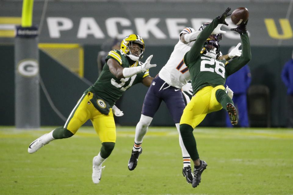 Green Bay Packers' Darnell Savage intercepts a pass in front of Chicago Bears' Anthony Miller during the second half of an NFL football game Sunday, Nov. 29, 2020, in Green Bay, Wis. (AP Photo/Mike Roemer)