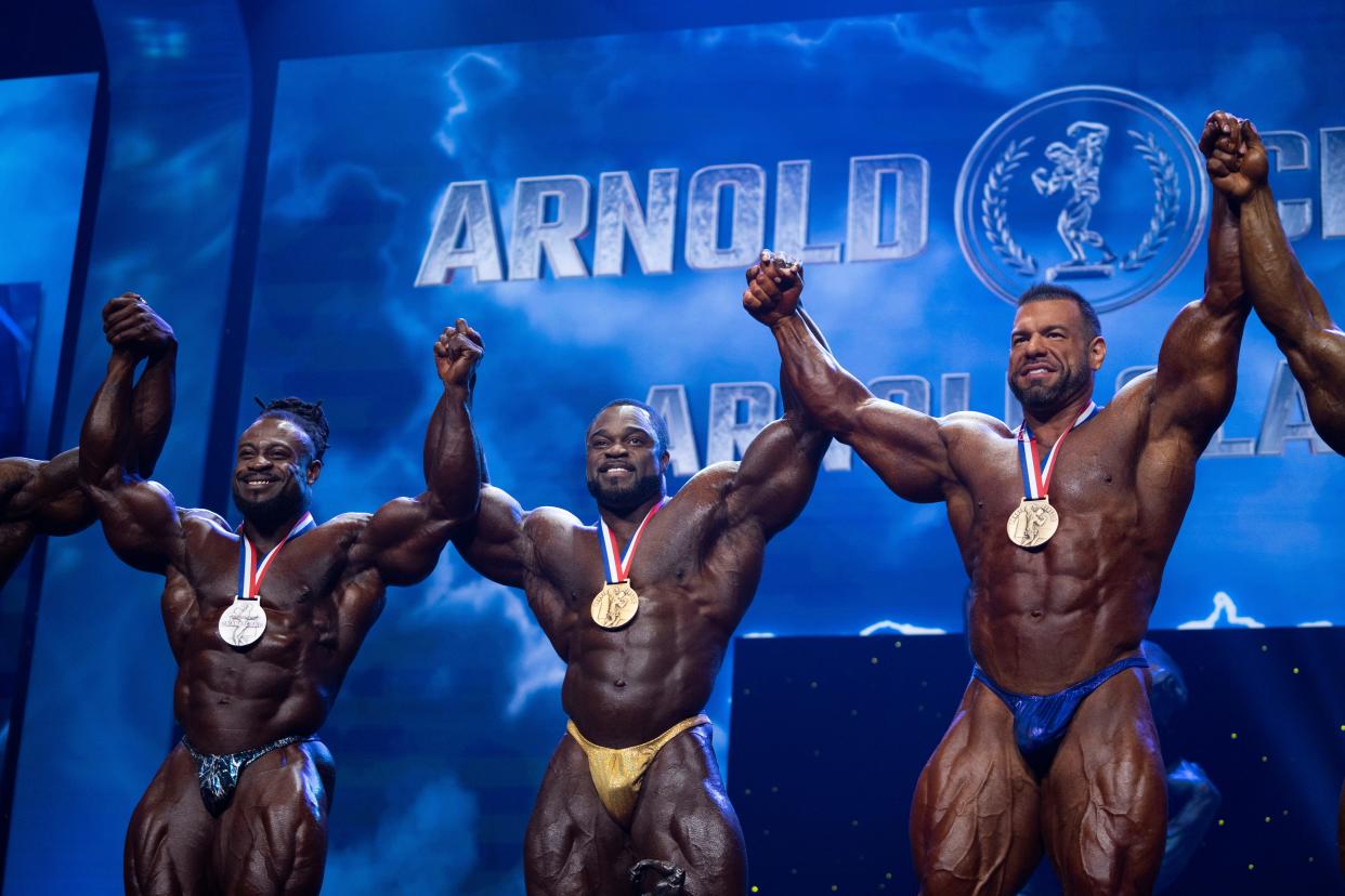Winner of the Arnold Classic Brandon Curry, center, poses with his competitors during the third day of the Arnold Sports Festival at the Greater Columbus Convention Center in Columbus, Ohio, on Saturday, March 5, 2022.