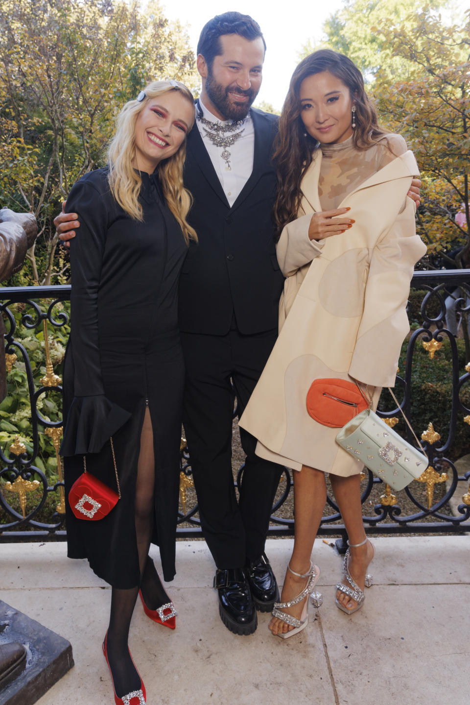 Camille Razat, Gherardo Felloni and Ashley Park at the Roger Vivier event in Paris.