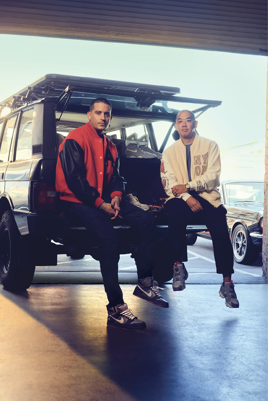 With the Nike Dunk SB Low “Pigeon” laced up, G-Eazy (L) speaks with Jeff Staple on location at The Motoring Club in Los Angeles. - Credit: Justin Bettman