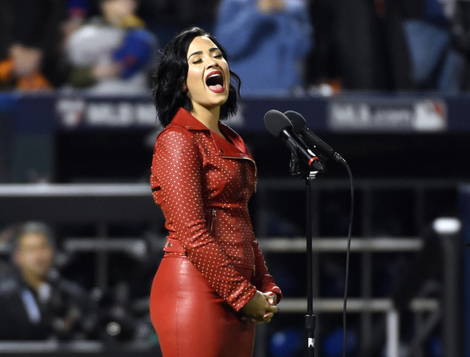 Recording artist Demi Lovato performs the national anthem in game four of the World Series between the Kansas City Royals and the New York Mets at Citi Field. Mandatory Credit: Robert Deutsch-USA TODAY Sports / Reuters Picture Supplied by Action Images (TAGS: Sport Baseball MLB) *** Local Caption *** 2015-10-31T235724Z_1326565651_NOCID_RTRMADP_3_MLB-WORLD-SERIES-KANSAS-CITY-ROYALS-AT-NEW-YORK-METS.JPG