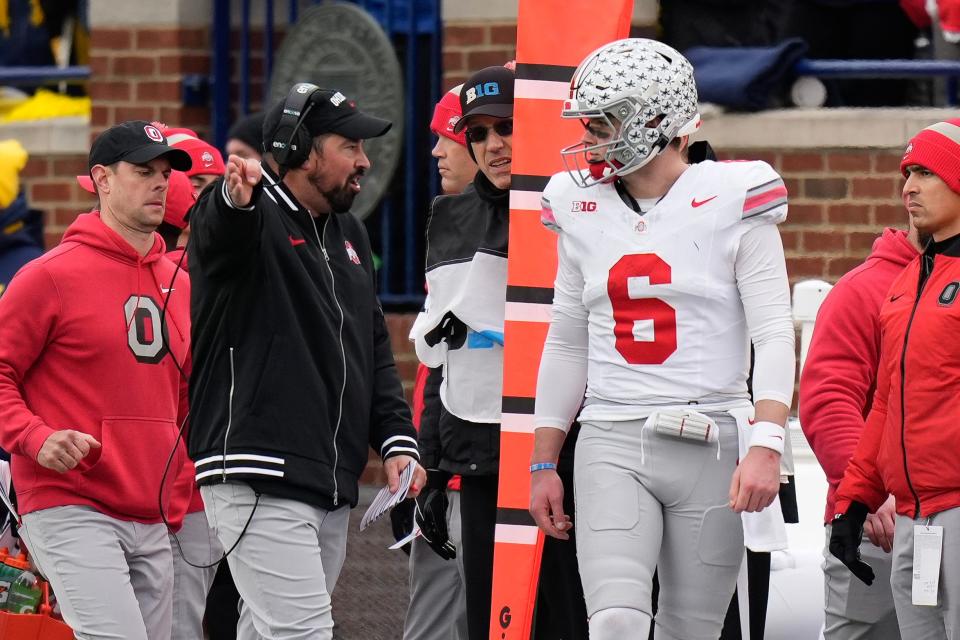 Ohio State coach Ryan Day talks to quarterback Kyle McCord during the loss to Michigan.