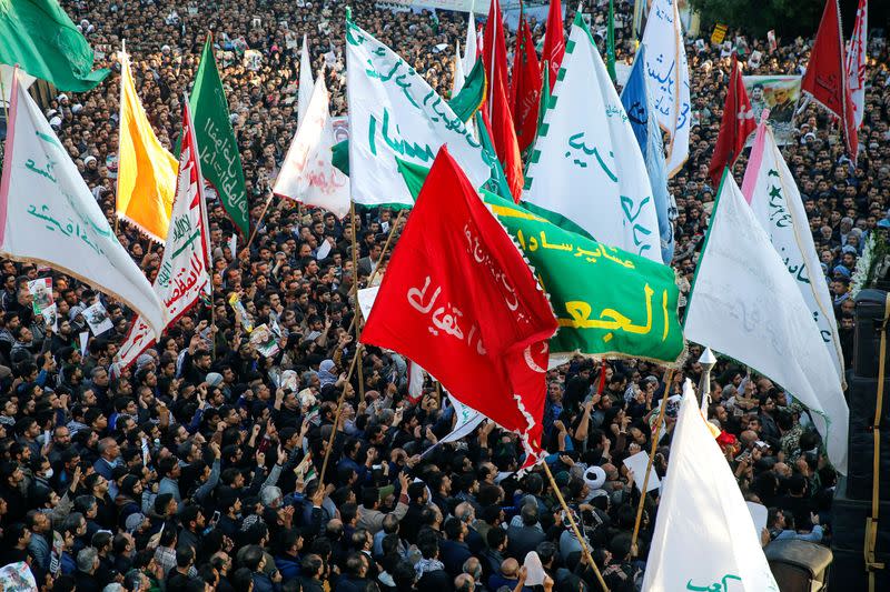 People attend a funeral procession for Soleimani and al-Muhandis, in Ahvaz