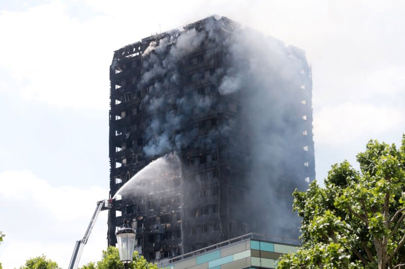 A 24-story building containing more than 120 flats lies in ruins after catching fire in the early hours of June 14, 2017, killing nearly 80 people. File Photo Hugo Philpott/UPI