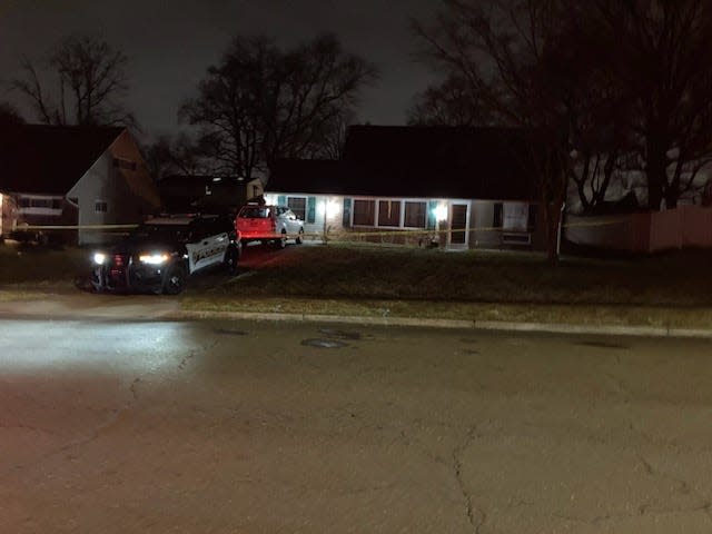 Middletown Police guard the house on Upper Orchard Drive in Levittown, where a man was found dead in a downstairs bathroom Tuesday night.