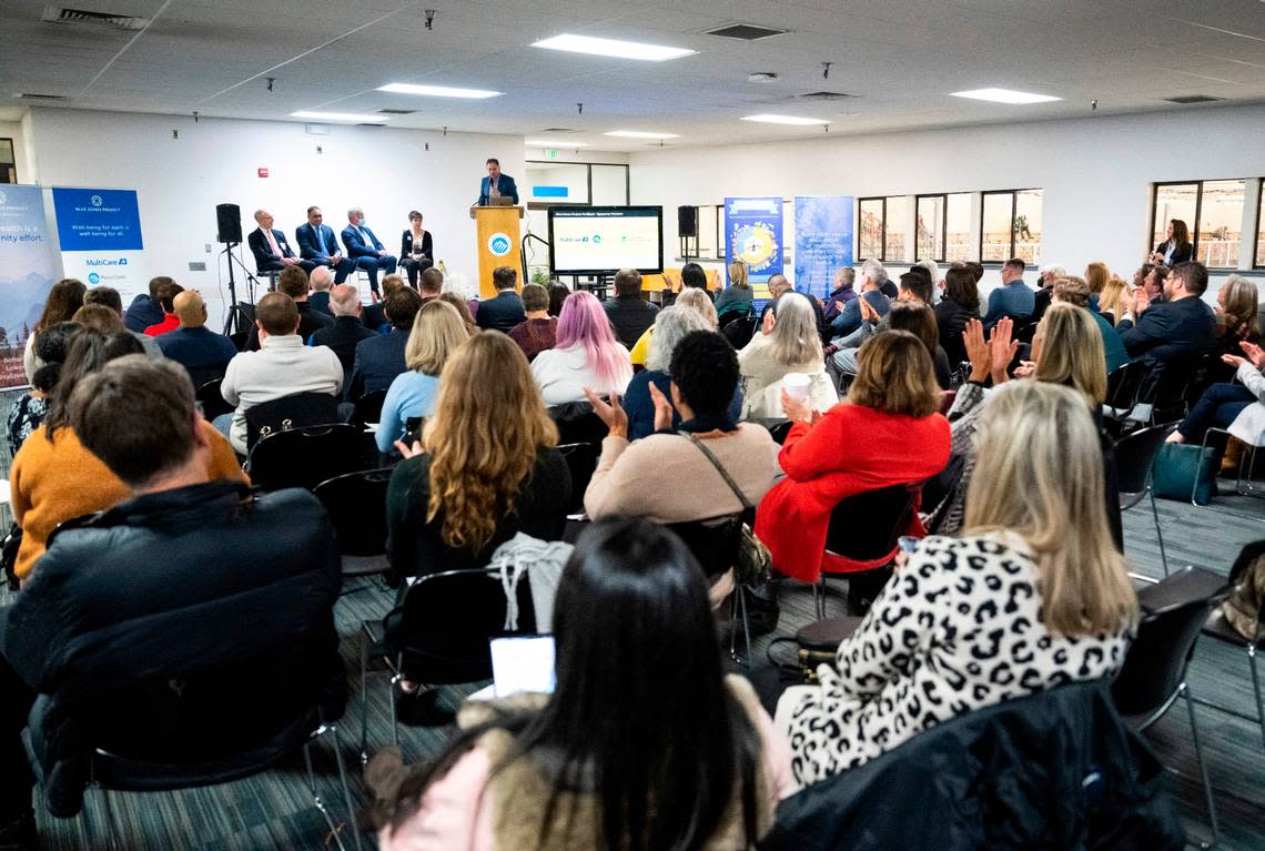 Blue Zones Vice President of community engagement Nick Buettner moderates a discussion about Blue Zones Project, a collaboration of the local health care systems and Pierce County to improve health outcomes for residents in Parkland and Spanaway, at the Sprinker Recreation Center on Dec. 12, 2022.