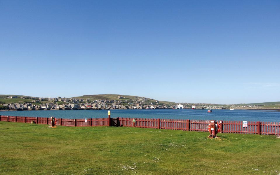 Just a red picket fence separates campers from the sea - Credit: ALAMY