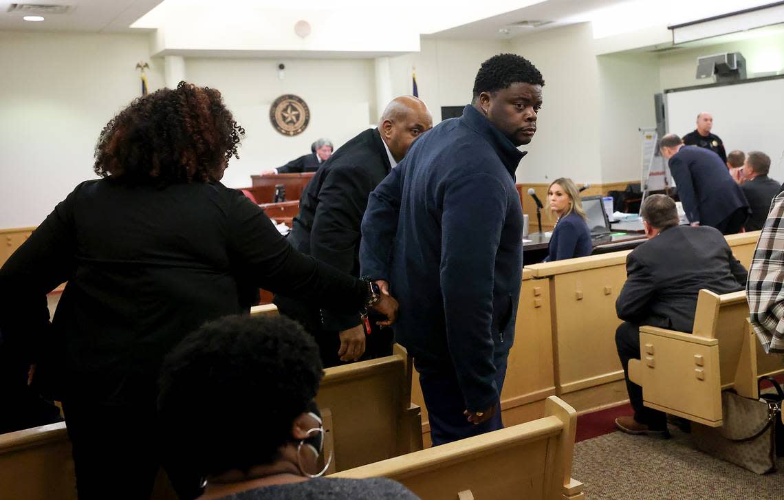 Adarius Carr, right, holds his sister Ashley Carr’s hand as they leave the 396th District Court after Aaron Dean was found guilty of manslaughter. Dean killed Atatiana Jefferson in her home while responding to a call about her front door being open late at night.