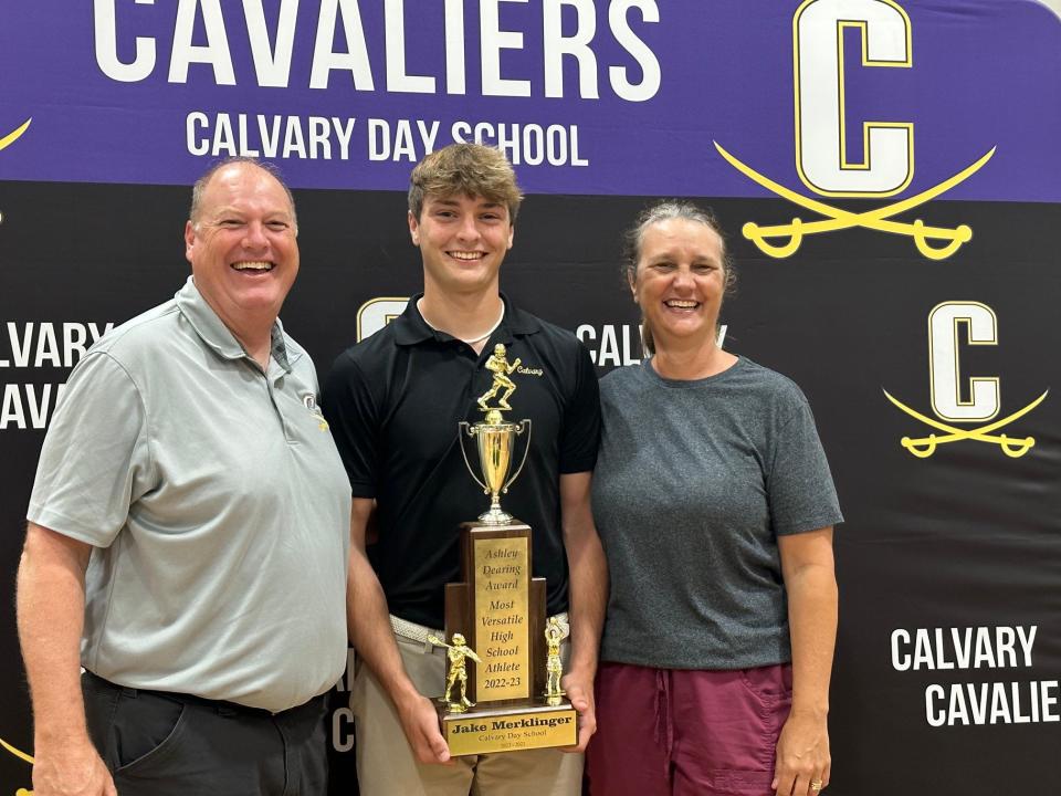 Jake Merklinger, pictured with his parents, received the Ashley Dearing Award trophy on May 15, 2023.