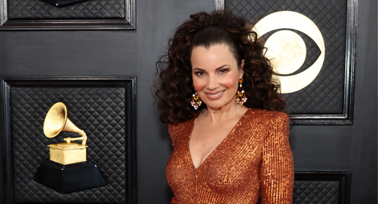 Fran Drescher wearing burnt orange sequinned jumpsuit at 2023 grammy awards on red carpet