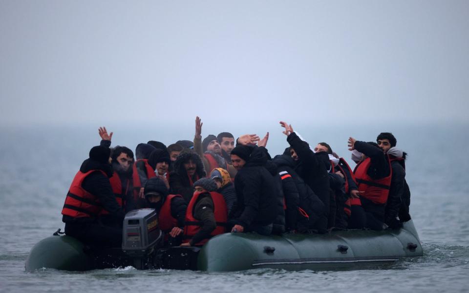 A group of more than 40 migrants after getting on an inflatable dinghy to leave France for England - Gonzalo Fuentes/Reuters