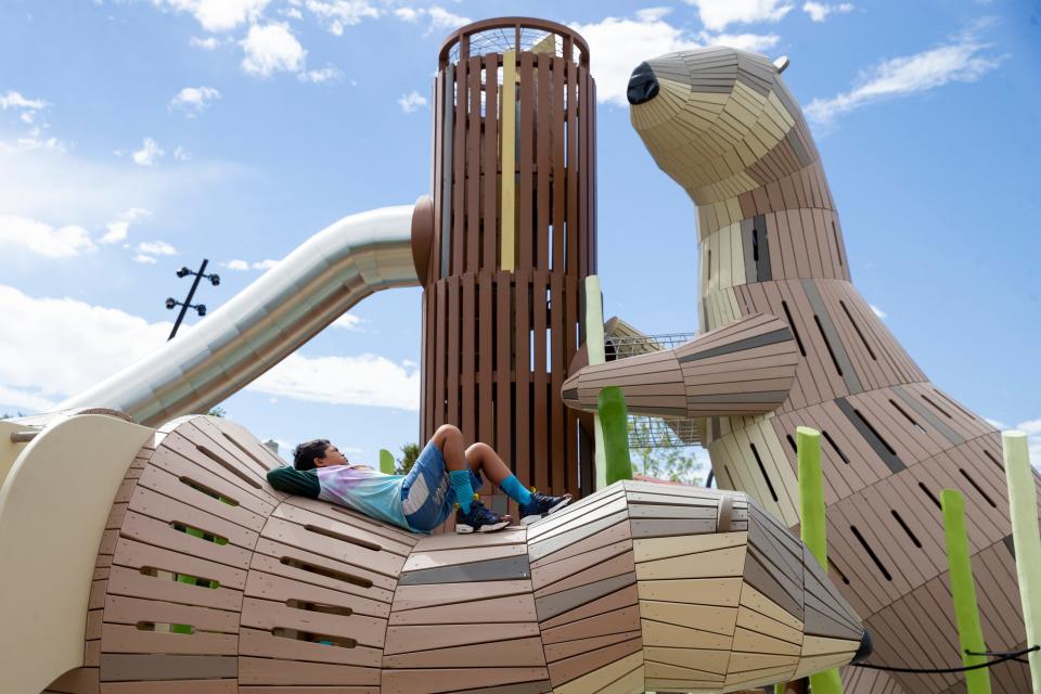 Ashvin Peterson, 9, lounges on the playground in Tom Lee Park a day before the newly renovated park opens to the public in Downtown Memphis, Tenn., on Friday, September 1, 2023. The structures in the playground are based on the wildlife found in the Mississippi River.