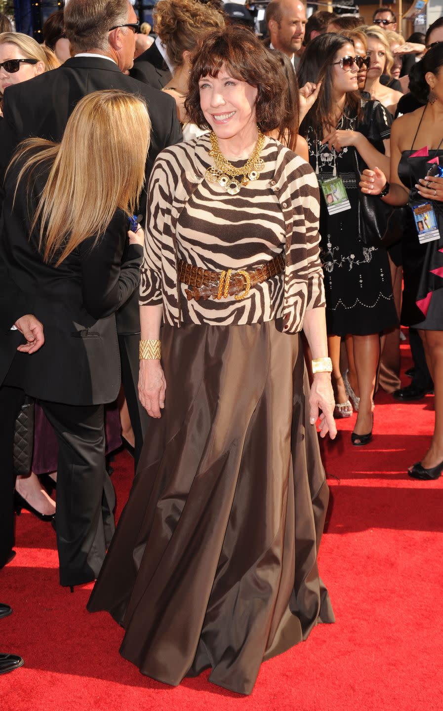 <p>In a belted brown and zebra number.</p>