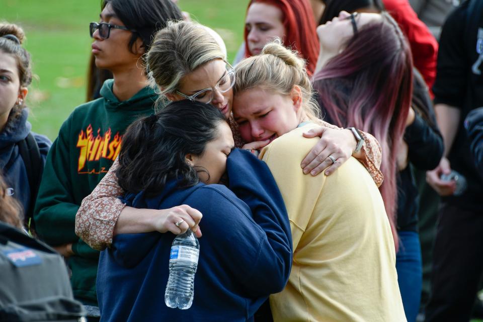 Saugus High students hug as they wait to be picked up by family members at a reunification point after a shooting at Saugus high school in Santa Clarita, Calif. on Nov 14. 2019.  