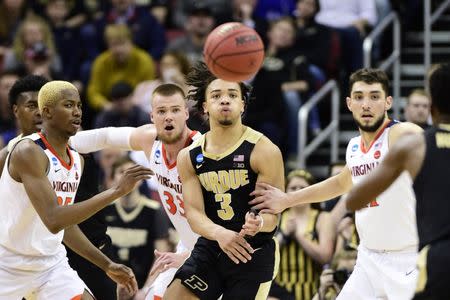 Mar 30, 2019; Louisville, KY, United States; Purdue Boilermakers guard Carsen Edwards (3) passes the ball as Virginia Cavaliers forward Mamadi Diakite (25) and center Jack Salt (33) defend during the second half in the championship game of the south regional of the 2019 NCAA Tournament at KFC Yum Center. Mandatory Credit: Thomas J. Russo-USA TODAY Sports