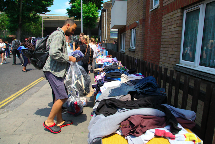 Rory joined volunteers helping out with donations (Rex)