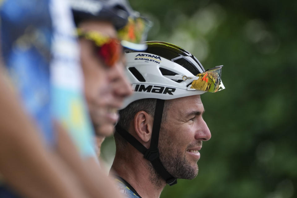 Britain's Mark Cavendish, right, smiles prior to the fourth stage of the Tour de France cycling race over 182 kilometers (113 miles) with start in Dax and finish in Nogaro, France, Tuesday, July 4, 2023. (AP Photo/Thibault Camus)