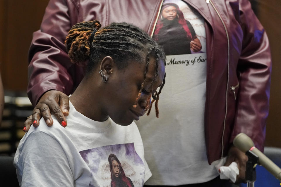 Aliyah, left, and Laverne Butler, sister and mother of Sarah Butler, wear shirts with Sarah Butler's picture as they give victim impact statements during the sentencing for Khalil Wheeler-Weaver in Newark, N.J., Wednesday, Oct. 6, 2021. Wheeler-Weaver, a New Jersey man who used dating apps to lure three women, including Robin West, to their deaths and attempted to kill a fourth woman five years ago, was sentenced to 160 years in prison on Wednesday, as he defiantly proclaimed his innocence. (AP Photo/Seth Wenig, Pool)