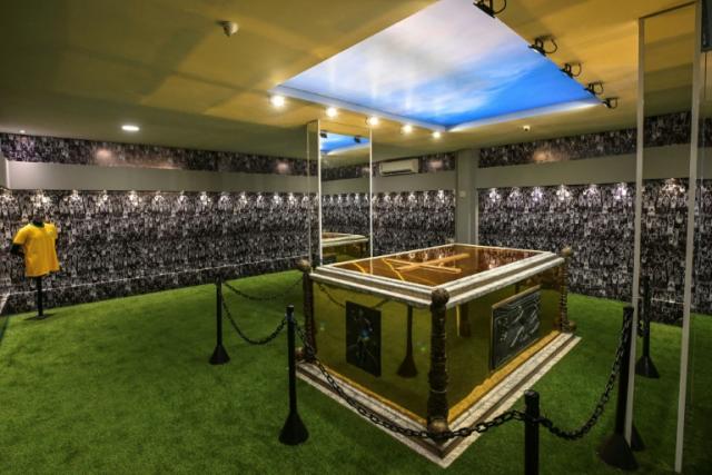 The gilded vault of late Brazilian football star Pele, surrounded by artificial turf, rests at the Ecumenical Memorial Cemetery in Santos, Brazil, on May 15, 2023