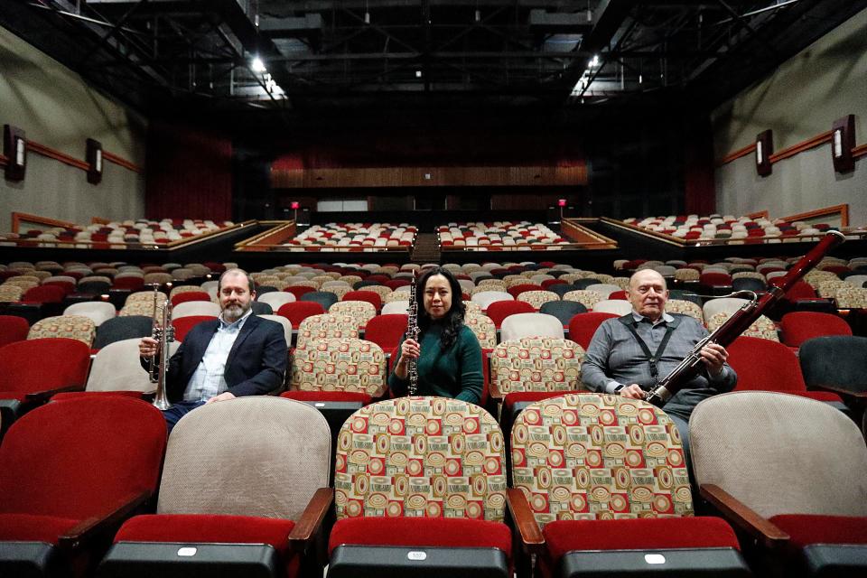 Bryan Agan, Ann Marie Hartley, and Raymond Patricio inside the Armstrong Campus Fine Arts Auditorium where they have preformed with the Savannah Winds.