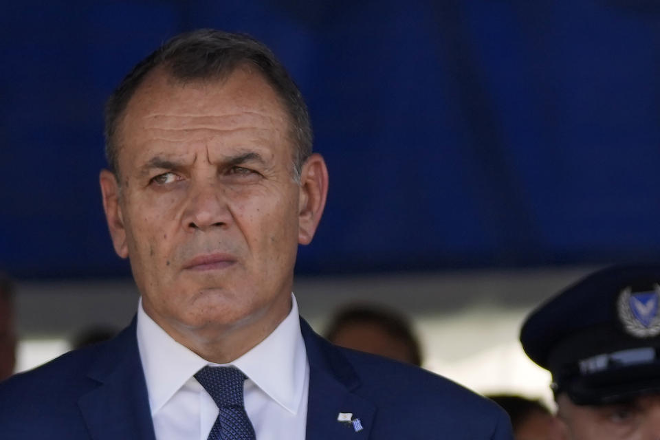 Greek defense minister Nikolaos Panagiotopoulos looks on after the end of a military parade marking the 62th anniversary of Cyprus' independence from British colonial rule, in Nicosia, Cyprus, Saturday, Oct. 1, 2022. Cyprus gained independence from Britain in 1960 but was split along ethnic lines 14 years later when Turkey invaded following a coup aimed at uniting the island with Greece. (AP Photo/Petros Karadjias)