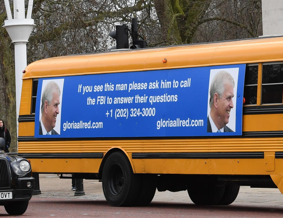 A yellow school bus with a message for the Duke of York from U.S. lawyer Gloria Allred drives along The Mall toward Buckingham Palace in London. (Photo: Stefan Rousseau / PA Images via Getty Images)