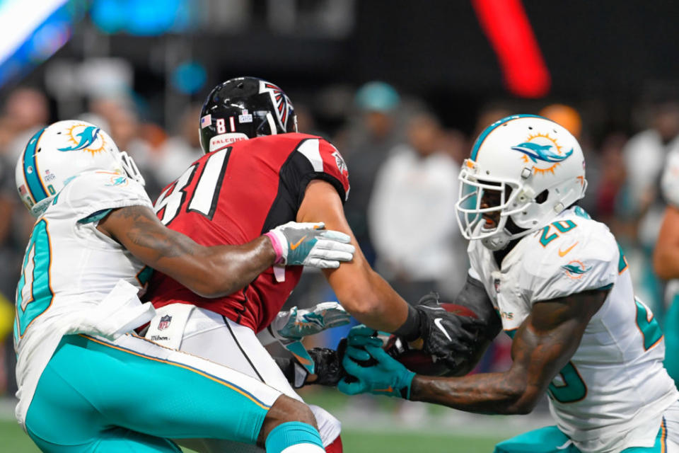 Oct 15, 2017; Atlanta, GA, USA; Atlanta Falcons tight end Austin Hooper (81) is hit by Miami Dolphins cornerback Cordrea Tankersley (30) causing an interception by Dolphins free safety Reshad Jones (20) in the last minute of the game during the second half at Mercedes-Benz Stadium. Mandatory Credit: Dale Zanine-USA TODAY Sports