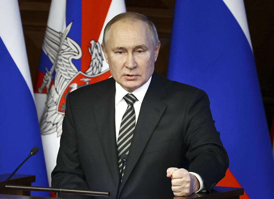 Russian President Vladimir Putin addresses an extended meeting of the Russian Defense Ministry Board at the National Defense Control Center in Moscow, Russia, Tuesday, Dec. 21, 2021. (Mikhail Tereshchenko, Sputnik, Kremlin Pool Photo via AP)