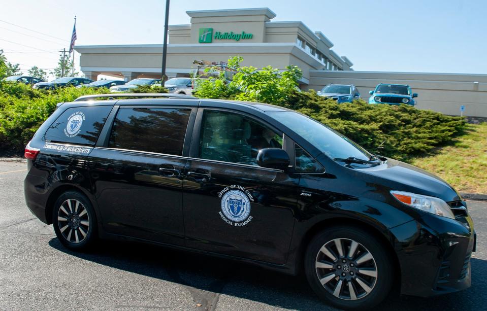 The state medical examiner arrives at the Holiday Inn on Lakeside Avenue in Marlborough, June 1, 2023. A woman was found dead in the parking lot behind the hotel earlier in the day.