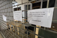 A restaurant that was closed as part of a crackdown by Lebanese General Security on businesses employing unregistered Syrian workers displays a sign informing customers of the closure, in Beirut, Lebanon, May 10, 2024. Hundreds of Syrians refugees left a remote northeastern Lebanese town back to Syria in a convoy Tuesday, amid a surge in anti-refugee sentiment in the small, crisis-hit country. The new push for repatriation comes as Lebanon's quarrelling ruling political parties have reached a rare consensus in recent years, all agreeing that Syrian refugees should be returned. (AP Photo/Hussein Malla)