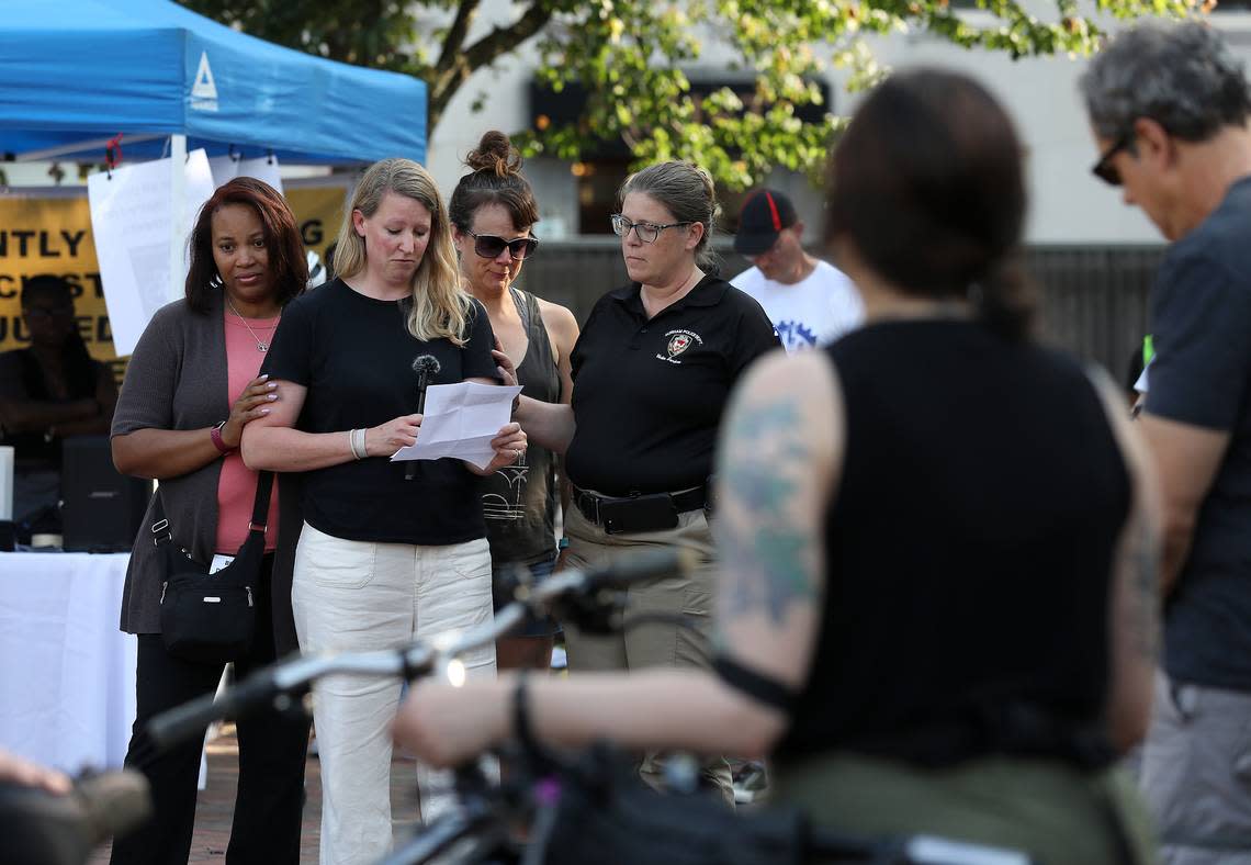 Allison Simpson, widow of Matt Simpson, speaks prior to the Ride of Silence on Wednesday, May 17, 2023, in Durham, N.C. Matt Simpson was killed in a hit-and-run while riding his bike in July 2022. The event remembers those who were killed or injured while biking.