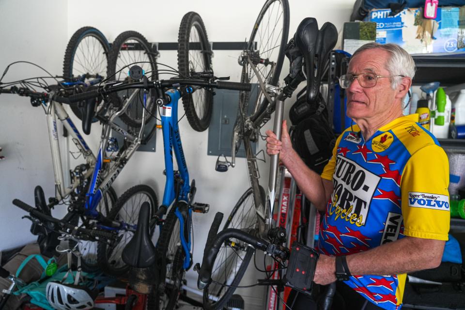 Frank Brewer takes a bike off of the wall of his garage before leaving his Leander home. Brewer is a retired Air Force pilot who flew F-4s and F16s. Then he flew for Southwest Airlines for 23 years before retiring in 2016. Now he flies a Van's RV-6.
