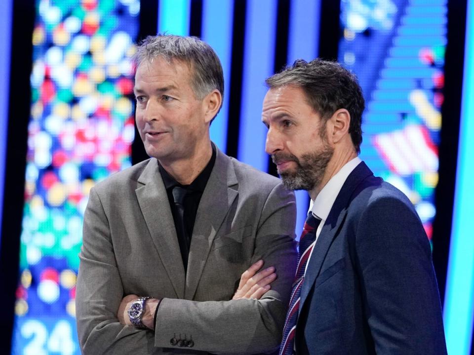 The head coaches of England, Gareth Southgate, right, and Denmark, Kasper Hjulmand (AP)