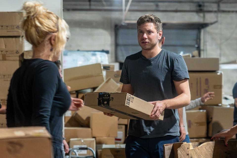 Yair Netanyau, son of Israeli Prime Minister Benjamin Netanyahu, assists in sorting donated supplies to IDF soldiers and Israeli families impacted by the Israel-Hamas war, with NGO Yedidim USA (Orit Ben-Ezzer/ZUMA Press Wire/Shutterstock)