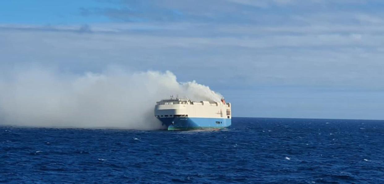 Smoke billows from Felicity Ace, which was carrying thousands of vehicles from Germany to the US