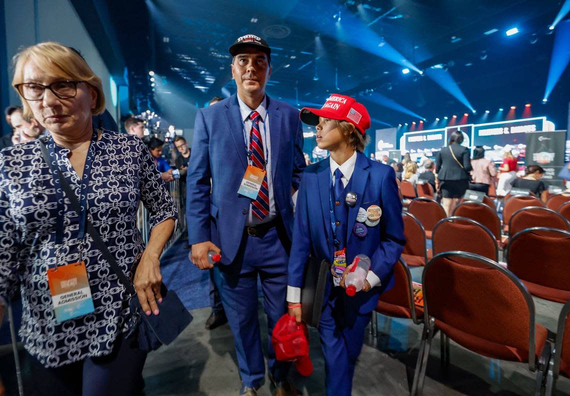 Paul Spencer arrives with his son Samuel Spencer, 12, at the Turning Point Action Believers Summit at the Palm Beach County Civic Center on Friday, July 26, 2024. Spencer is running for New Mexico State Representative.