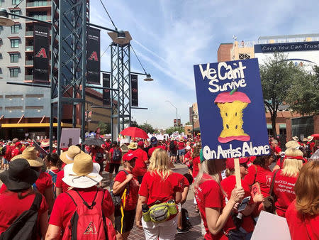 FILE PHOTO: Participants take part in a march in Phoenix, Arizona, U.S., April 26, 2018 in this picture obtained from social media. Christy Chavis/File Photo via REUTERS