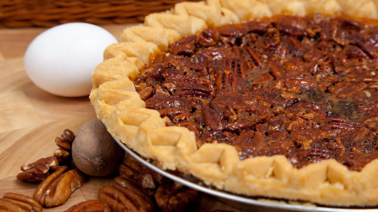 Pecan pie with egg on counter