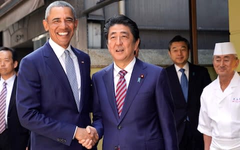 Former US president Barack Obama and Japan's Prime Minister Shinzo Abe renewed their friendship on Sunday - Credit: AFP