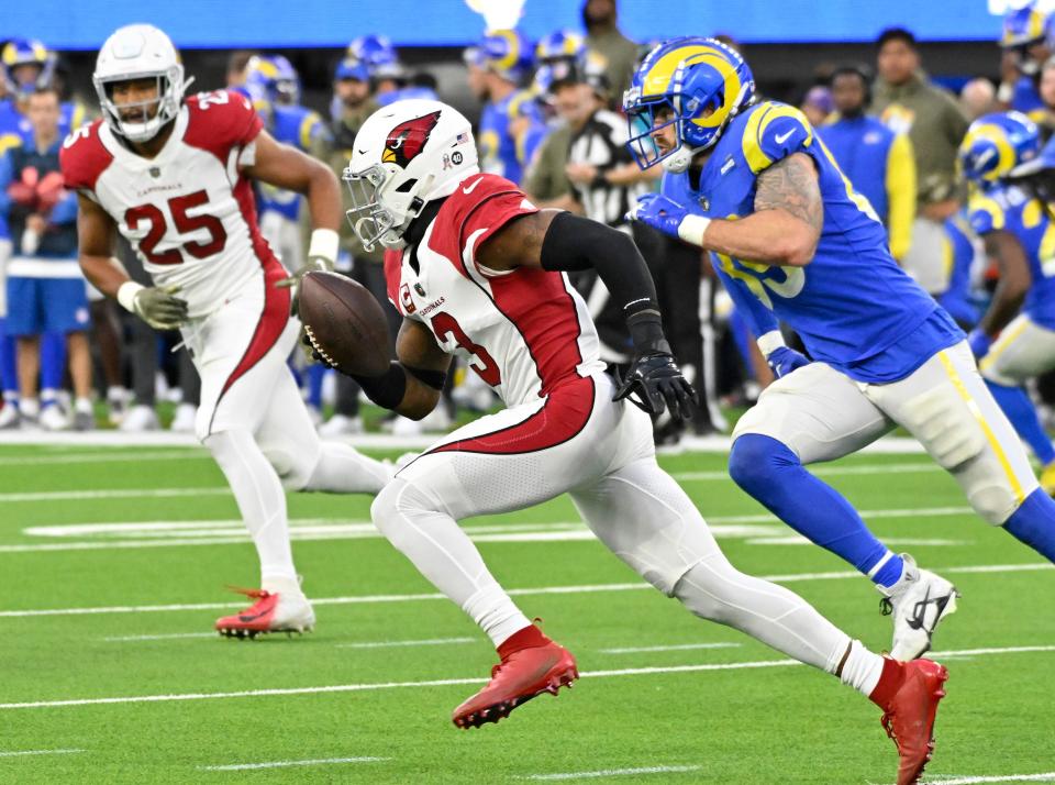 Arizona Cardinals safety Budda Baker (3) runs back an interception against the Los Angeles Rams.