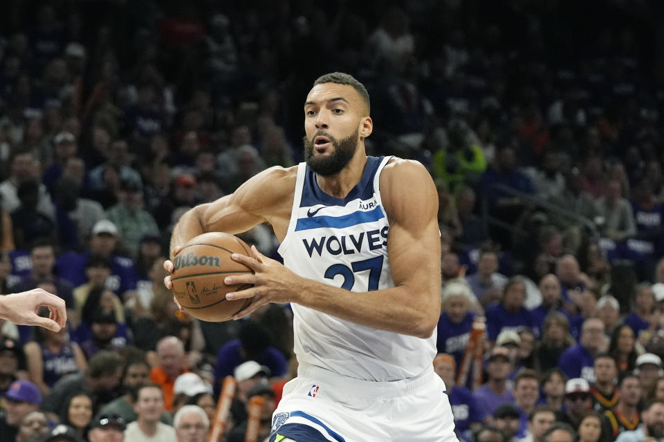 Minnesota Timberwolves center Rudy Gobert drives to the basket against the Phoenix Suns during the first half of Game 4 of an NBA basketball first-round playoff series Sunday, April 28, 2024, in Phoenix. (AP Photo/Ross D. Franklin)