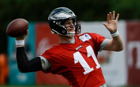 Philadelphia Eagles' quarterback Carson Wentz throws during practice at the team's NFL football training facility in Philadelphia - Credit: AP Photo/Matt Rourke